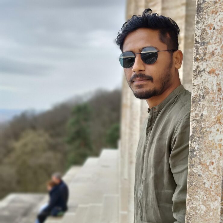 portrait-young-man-wearing-sunglasses-standing-outdoors_1048944-19754171